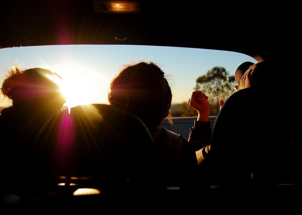 Free Image of Group of People Sitting in the Back of a Car 