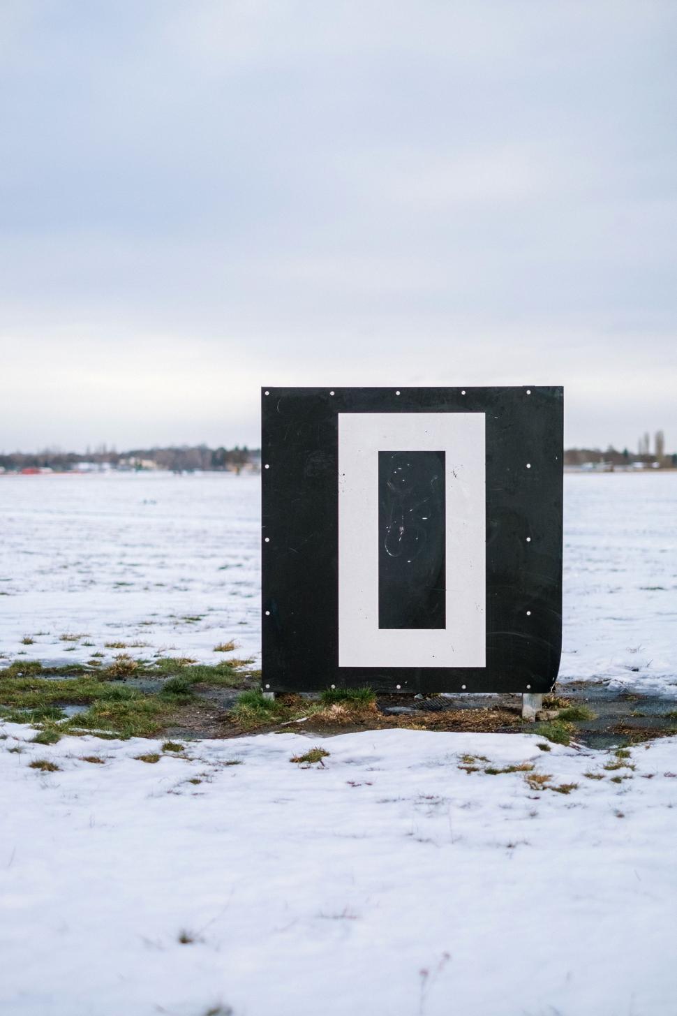 Free Image of Black and White Box in Snow Covered Field 