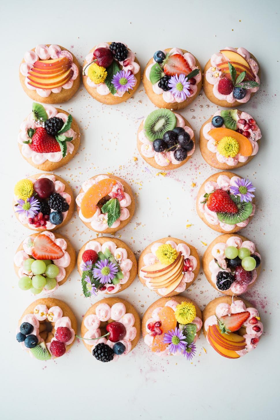Free Image of Plate of Cupcakes Topped With Fruit 