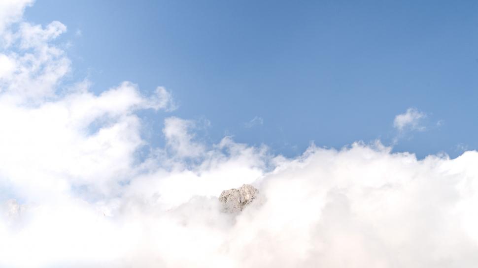 Free Image of Snowboarder Riding in the Clouds 