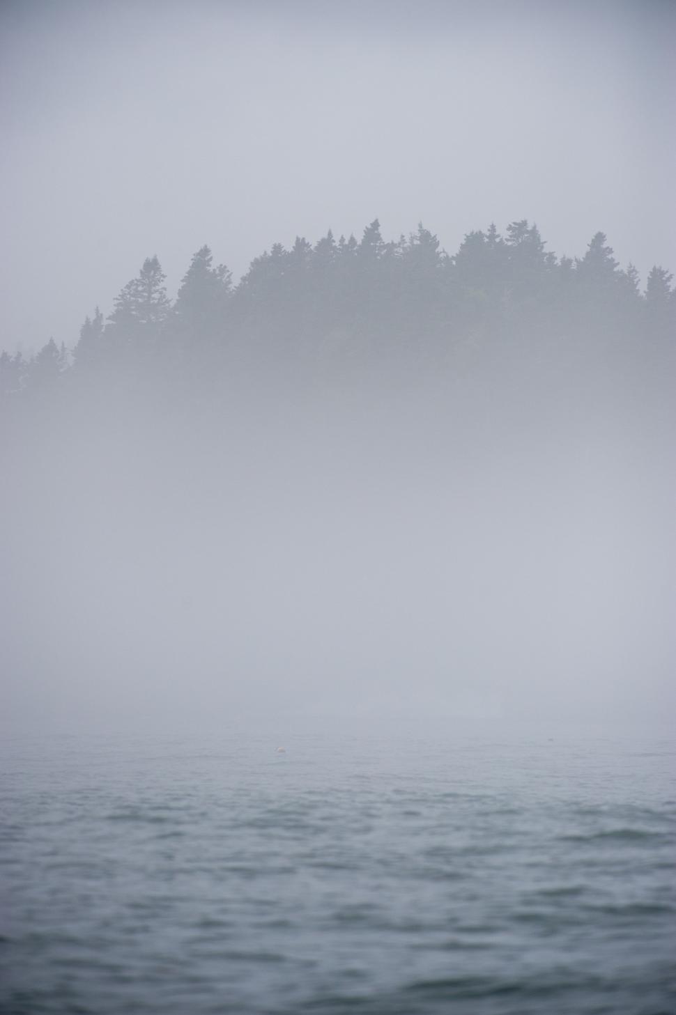 Free Image of Boat Sailing on Foggy Water 
