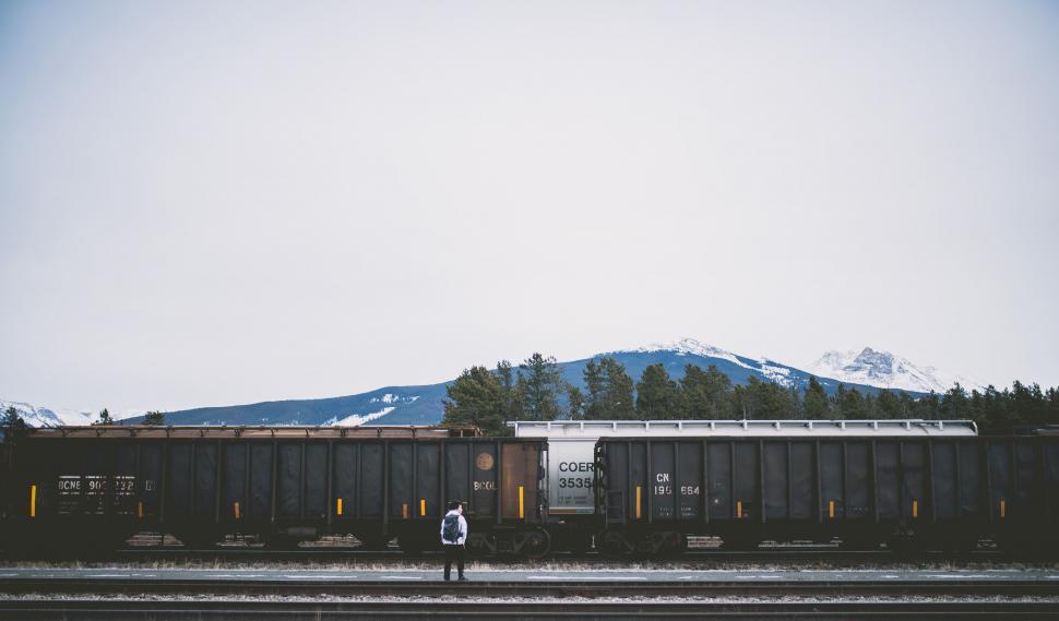 Free Image of Train on Train Track With Mountain Background 
