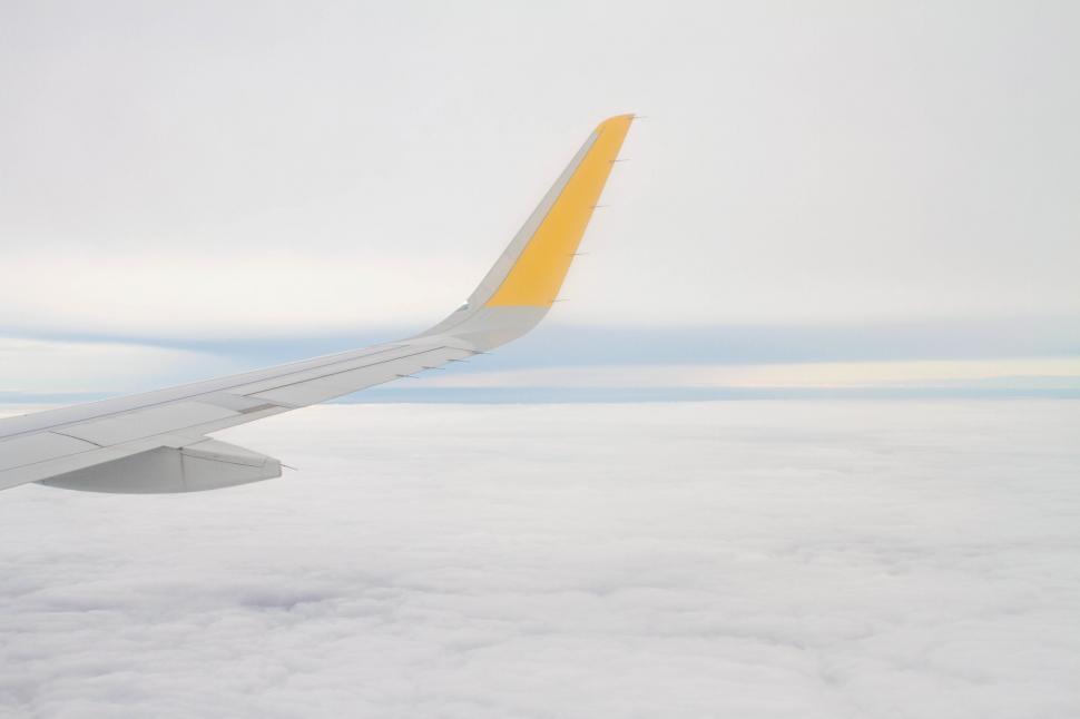 Free Image of A View of the Wing of an Airplane in the Sky 