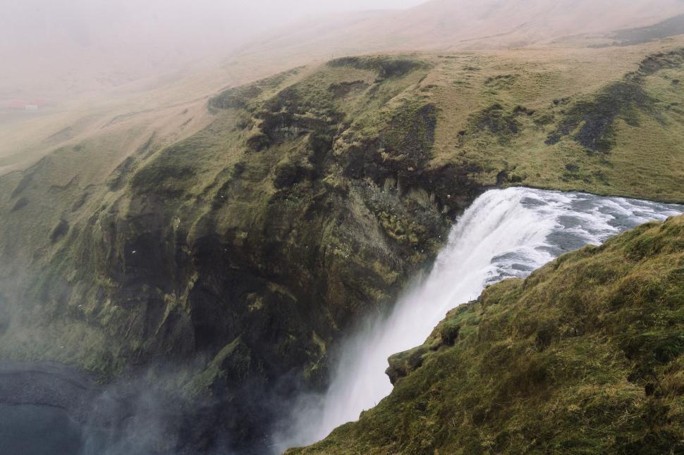 Free Image of Aerial View of a Waterfall in the Mountains 