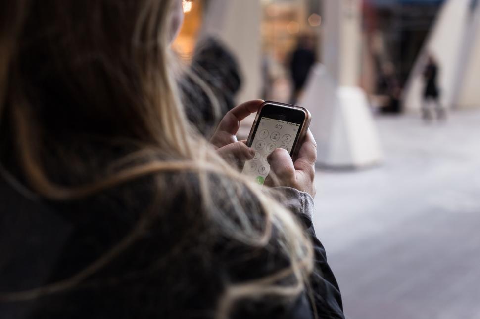 Free Image of Woman Looking at Her Cell Phone 