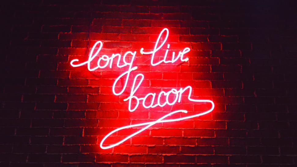 Free Image of Neon Sign That Says Long Live Bacon on a Brick Wall 