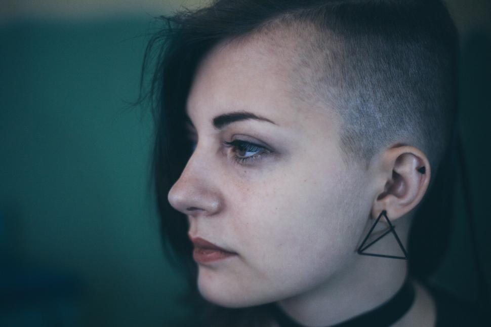 Free Image of Woman With Shaved Head Wearing Black Choker 