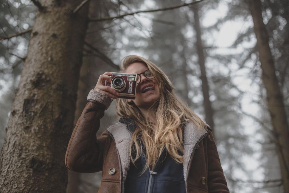Free Image of Woman Taking a Selfie in the Woods 