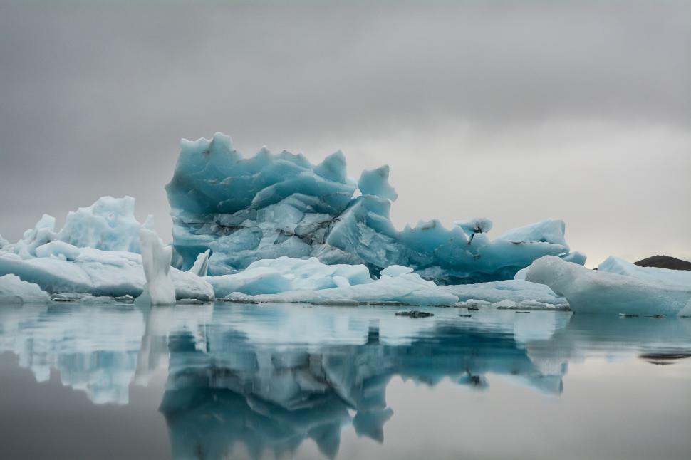 Free Image of Group of Icebergs Floating on Top of Water 