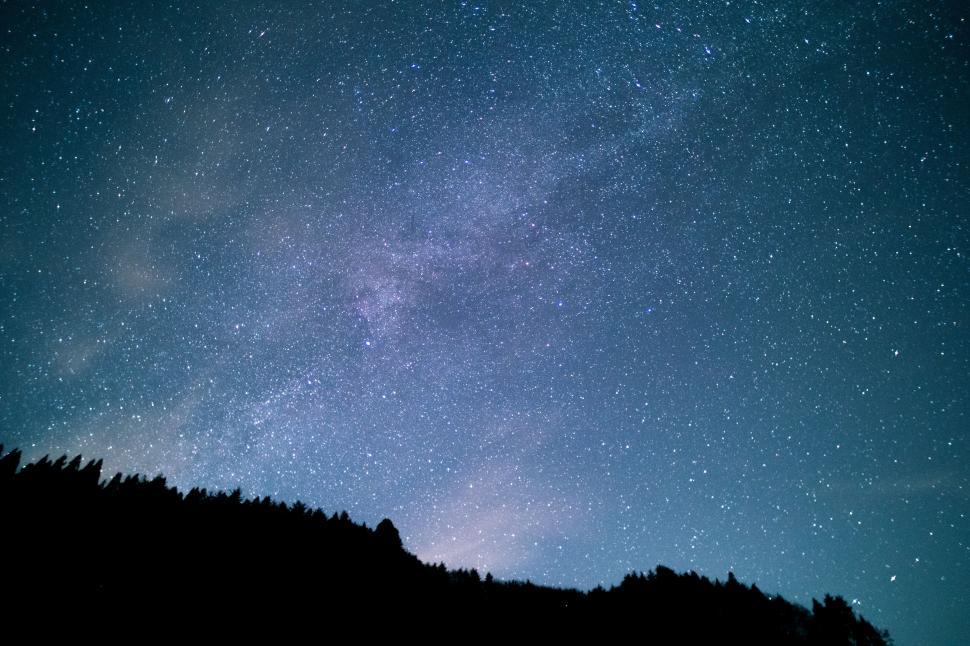 Free Image of Starry Night Sky Above a Hill 