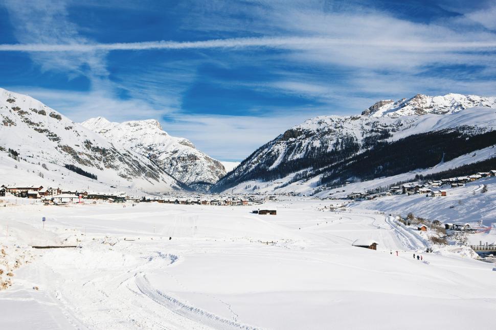 Free Image of Snowy Landscape With Mountains and Houses 