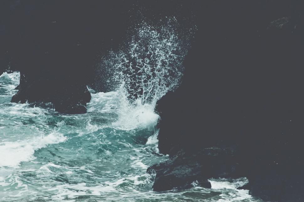 Free Image of Wave Crashing Into Rocks 