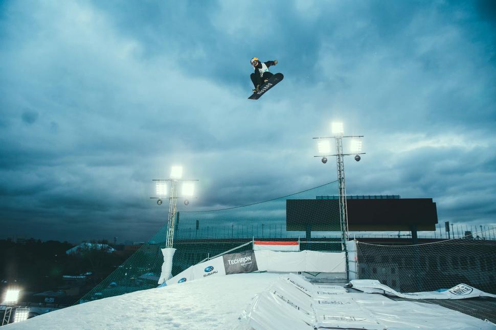 Free Image of Man Flying Through the Air on Snowboard 