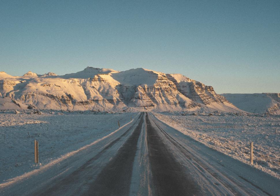 Free Image of Snow Covered Road With Mountains 