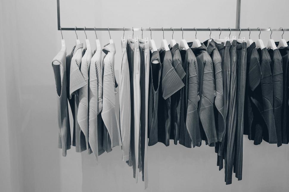 Free Image of Clothes Hanging on a Rack in Black and White 