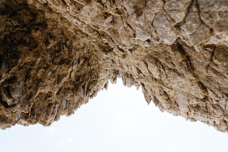 Free Image of Close Up of Rock Formation Against Sky Background 