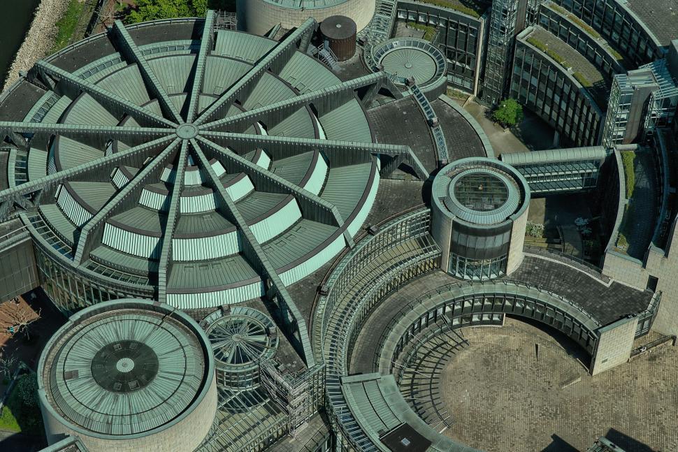 Free Image of Aerial View of Circular Building With Clock Tower 