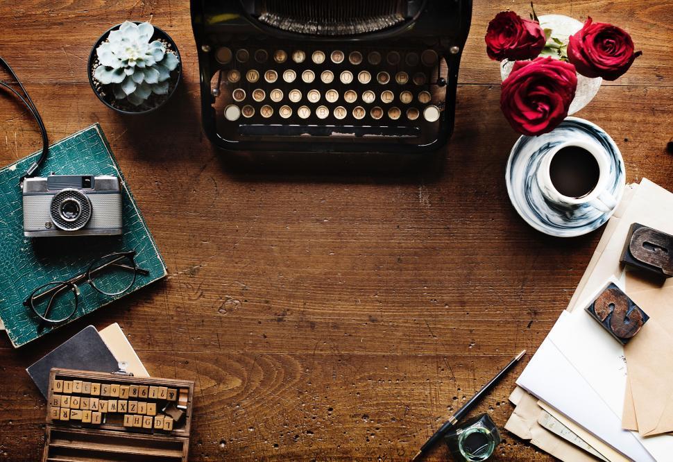 Free Image of Table With Typewriter and Coffee Cup 