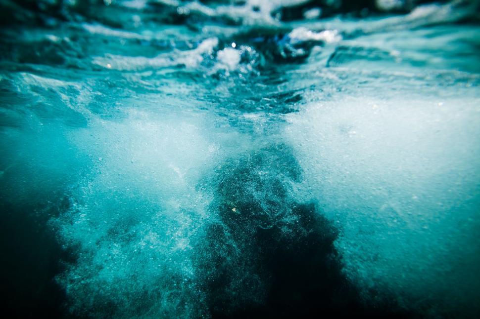 Free Image of Underwater View of Person Swimming in the Ocean 
