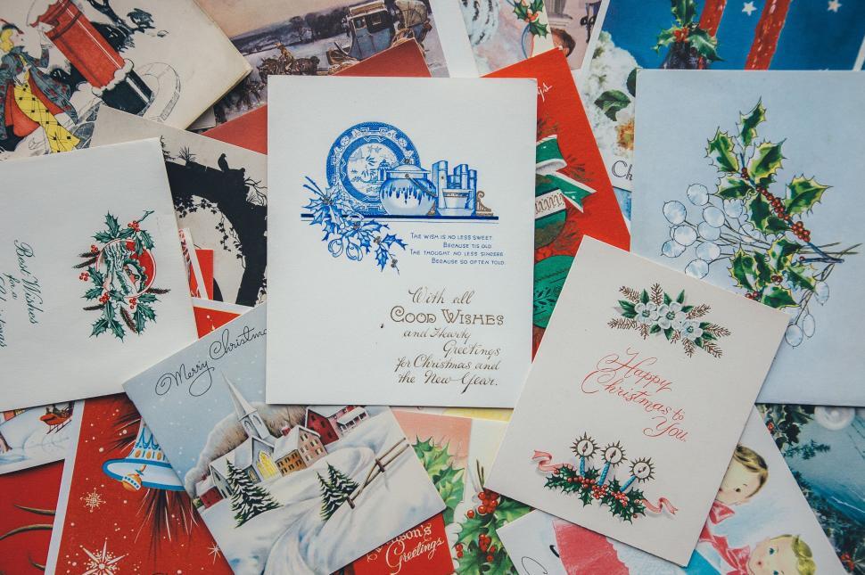 Free Image of A Pile of Christmas Cards on Table 