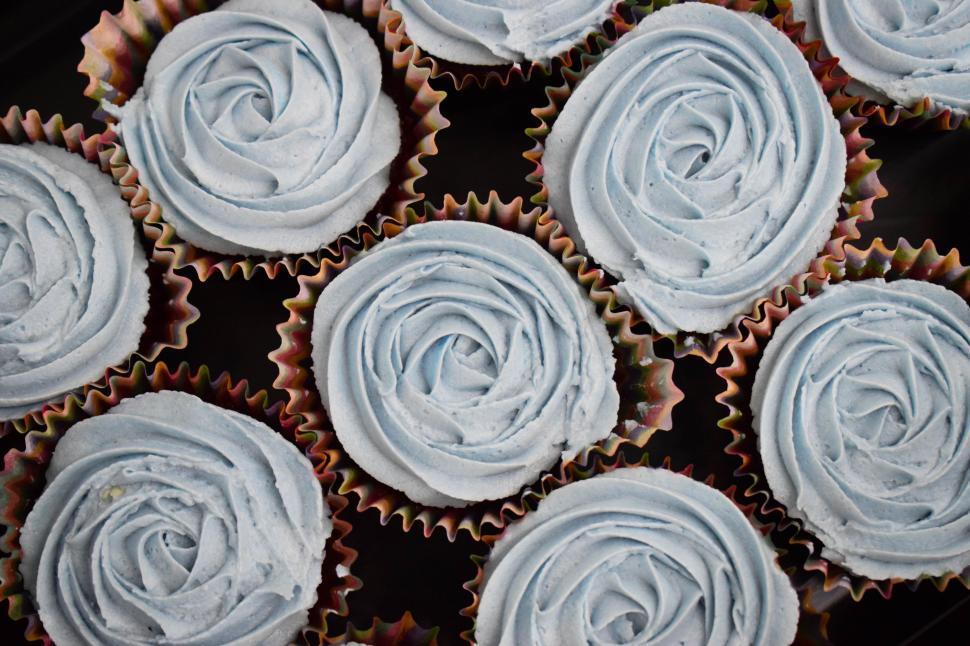 Free Image of Tower of Six Cupcakes With Frosting 
