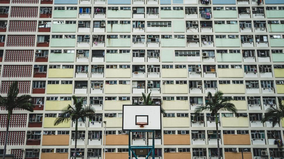 Free Image of Basketball Court in Front of Tall Building 