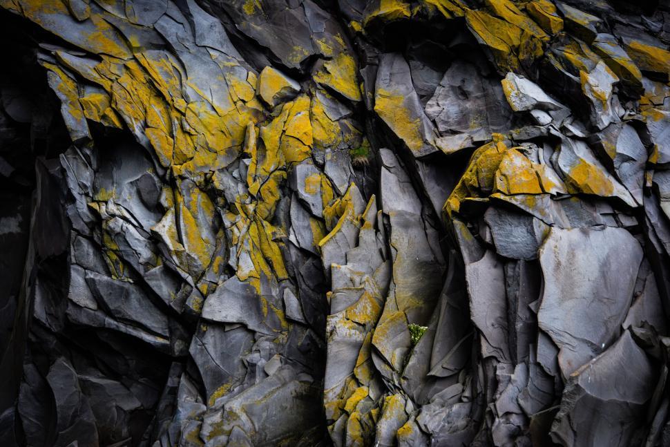 Free Image of Close Up of Rock Face With Yellow Moss 