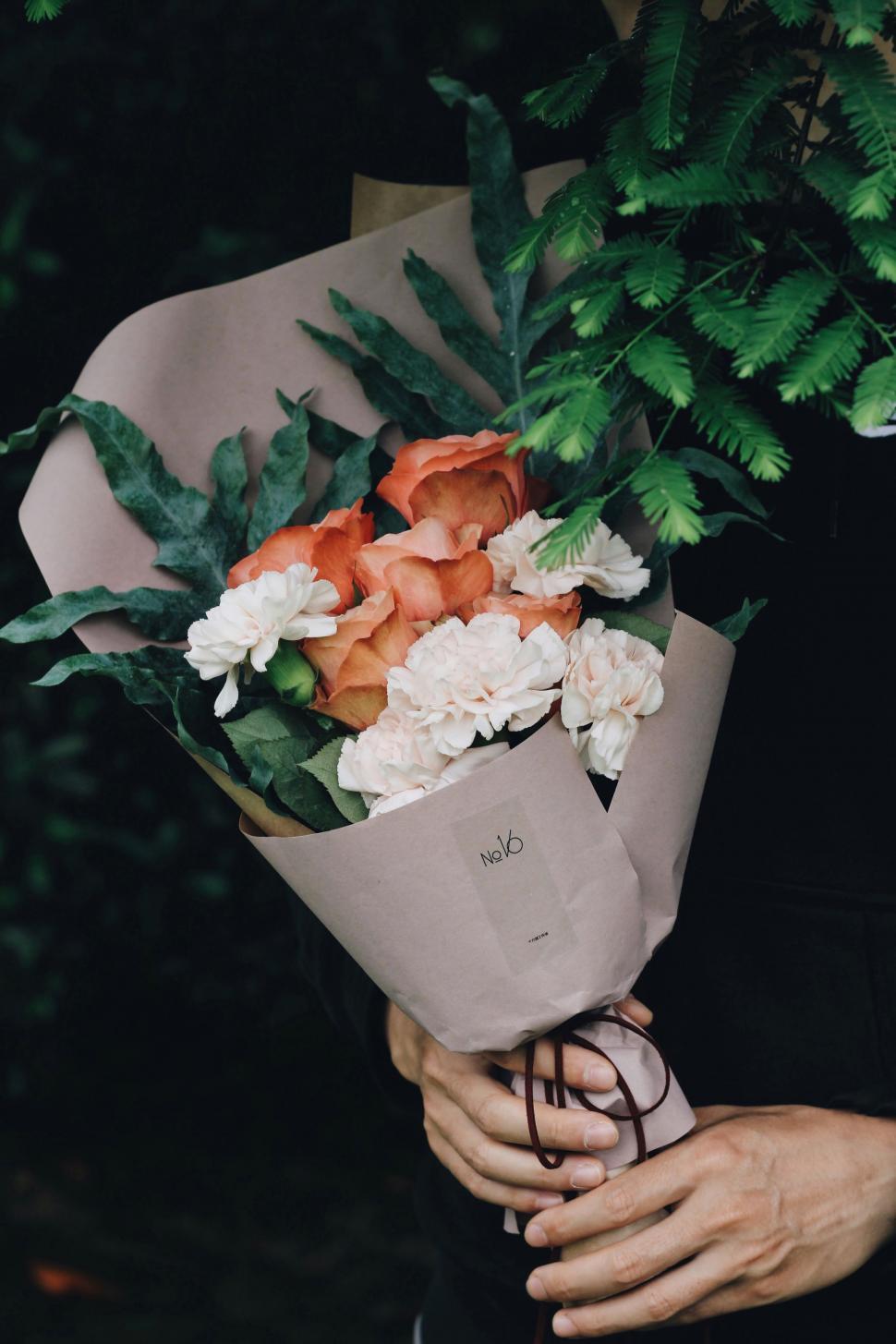 Free Image of Person Holding Bouquet of Flowers 