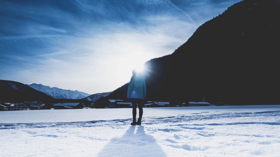 Free Image of Person Standing in Snow-Covered Field 