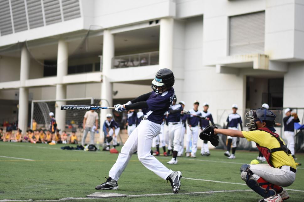 Free Image of Baseball Player Swinging Bat on Field 