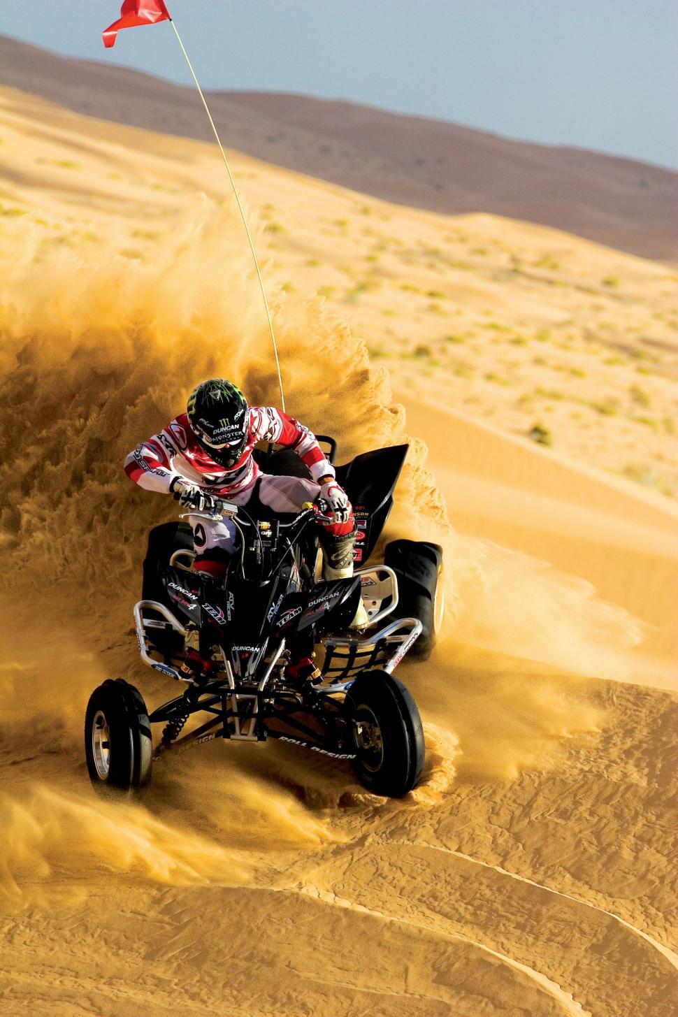 Free Image of Man Riding Four-Wheeler in Desert 
