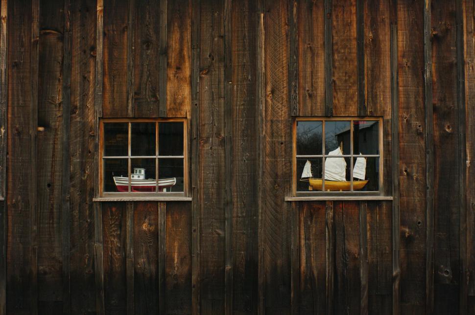 Free Image of Two Windows in a Wooden Building 