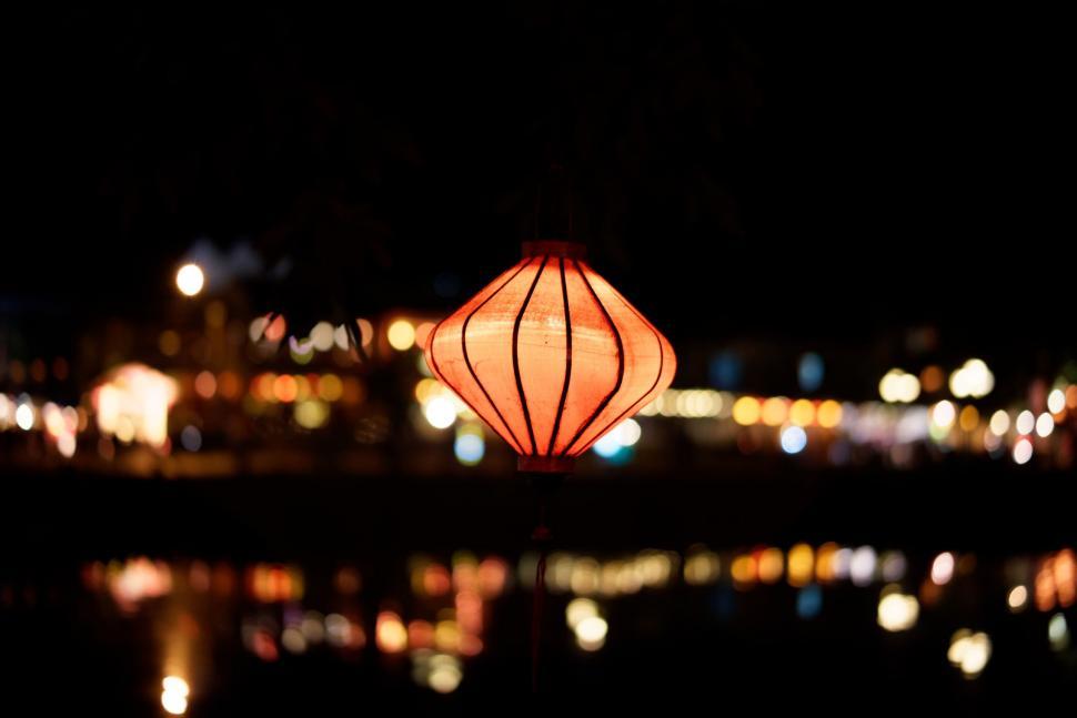 Free Image of Illuminated Lantern on Water Surface 