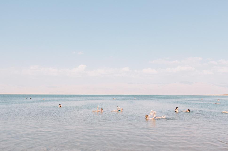 Free Image of Group of People Swimming in the Ocean 