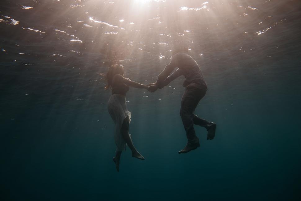 Free Image of Couple Swimming in Water 