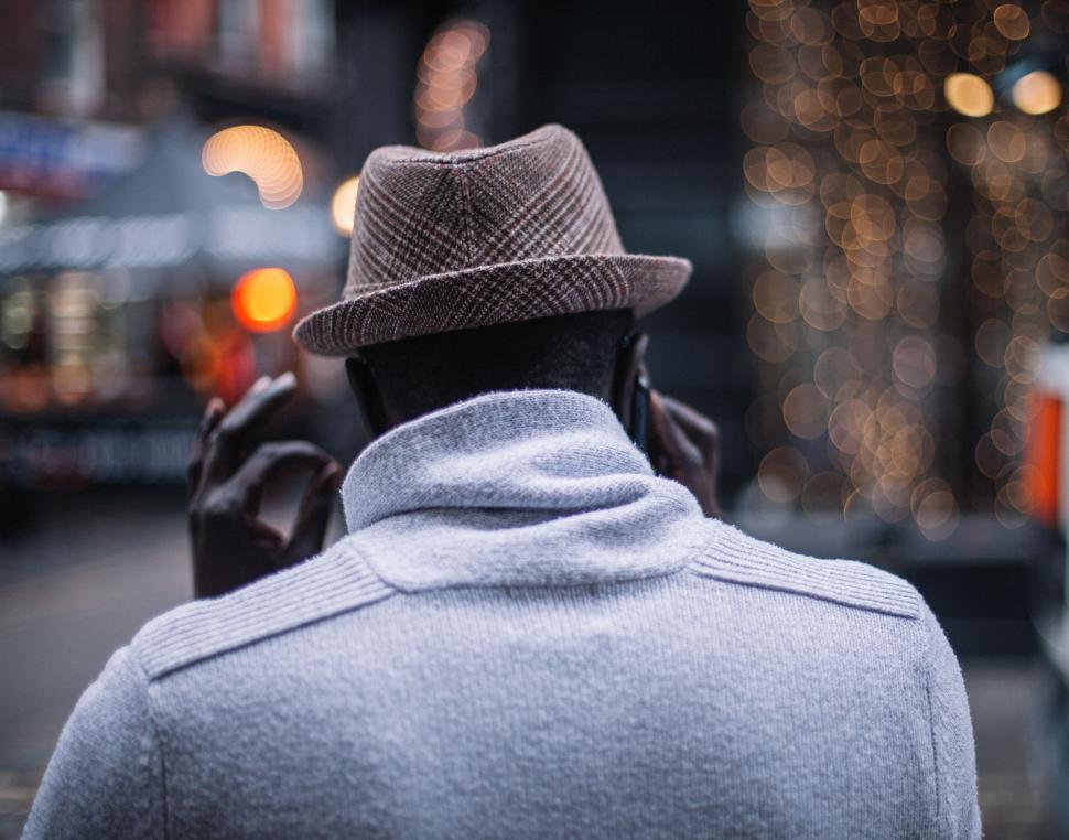 Free Image of Man in Hat and Jacket Walking on City Street 