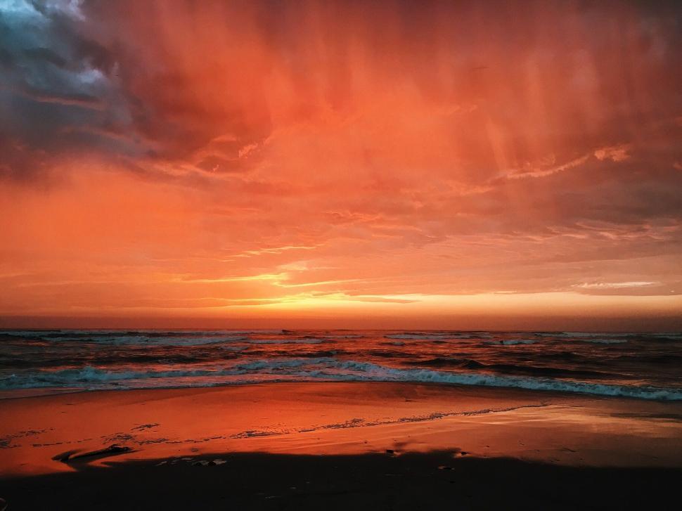 Free Image of Majestic Sunset Over the Ocean With Clouds 