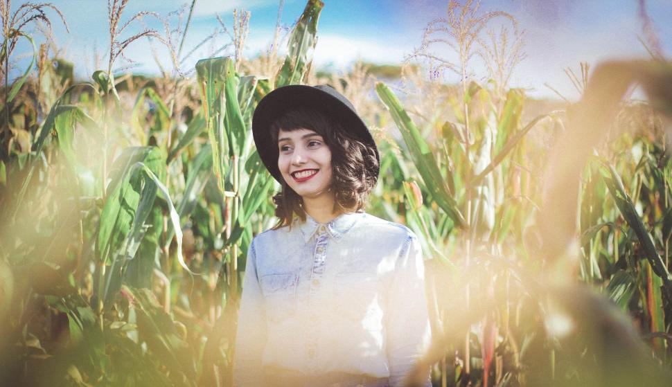 Free Image of Woman Standing in Cornfield 
