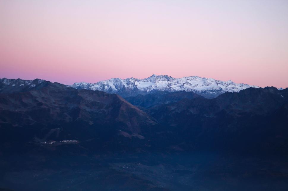 Free Image of Majestic Mountain Range Under Pink Sky 