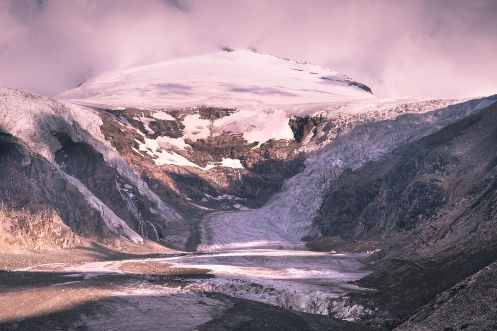 Free Image of Snow Covered Mountain With River Running Through 