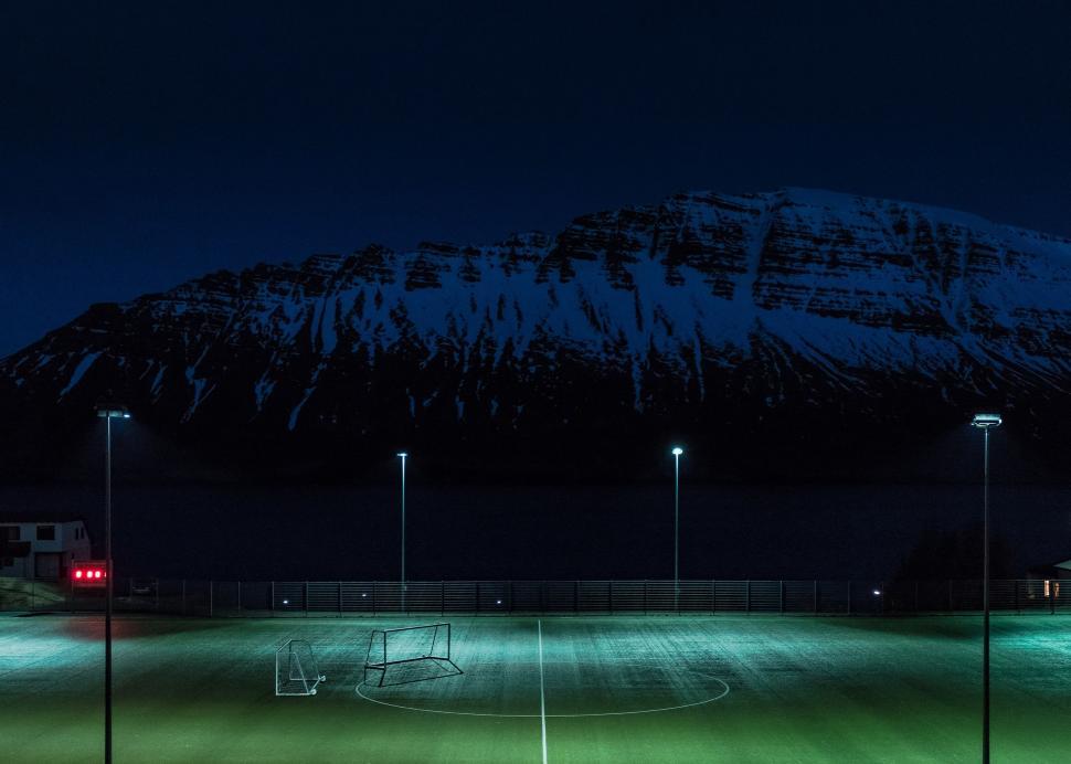 Free Image of Soccer Field With Mountain Background 
