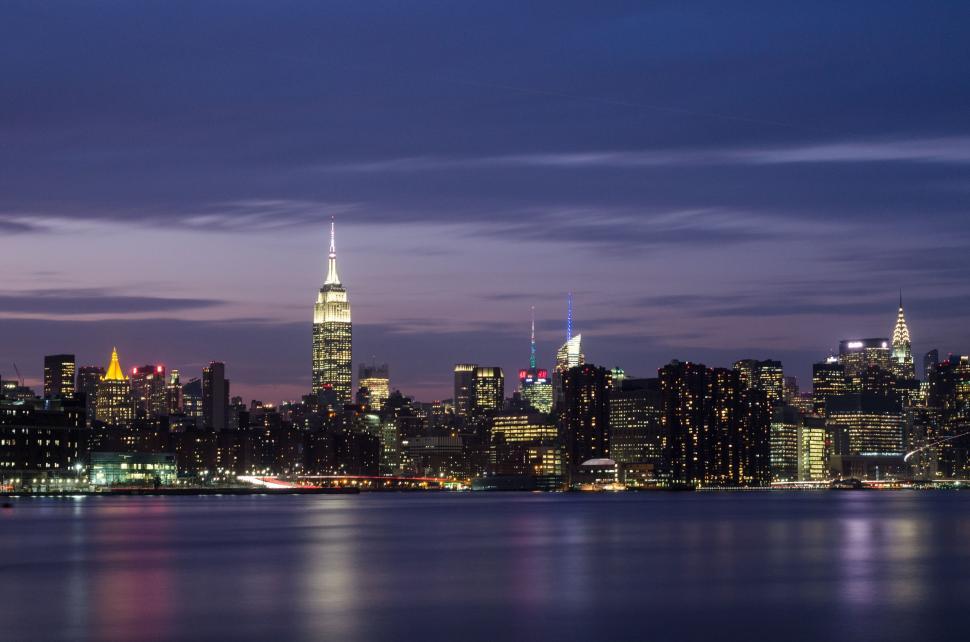 Free Image of City Skyline Illuminated at Night Across Water 