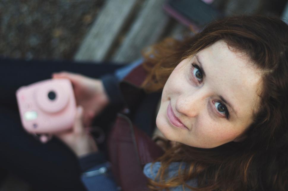 Free Image of Woman Holding Pink Camera in Her Right Hand 