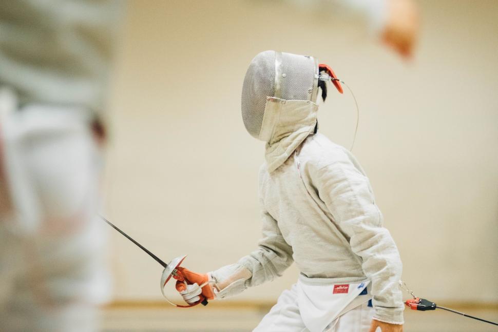 Free Image of Fencer in Suit Holding Stick 