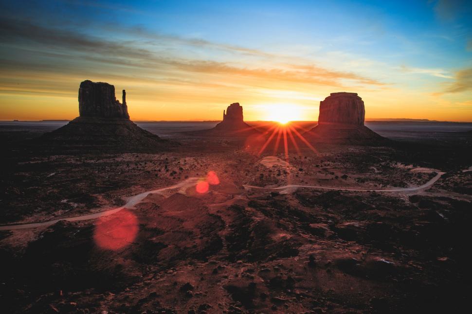 Free Image of Sun Setting Over Desert Landscape 