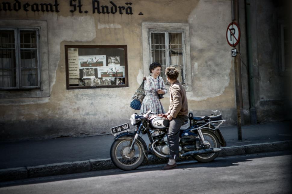 Free Image of Man and Woman Sitting on Motorcycle 