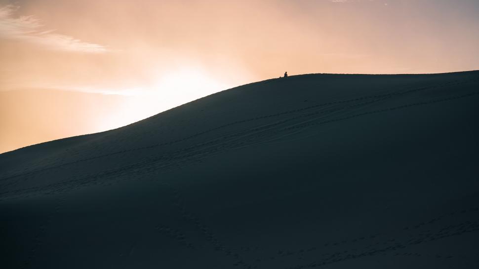 Free Image of Person Standing on Snow-Covered Hill 