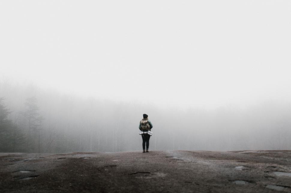 Free Image of Person Standing on Dirt Road in Fog 
