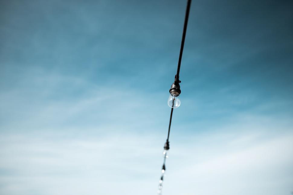 Free Image of Long Rope With a Drop of Water Hanging 