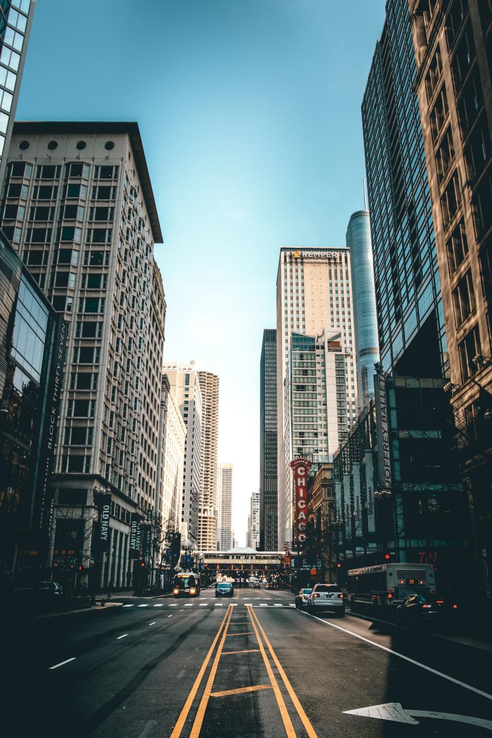 Free Image of Bustling City Street With Tall Buildings and Traffic 